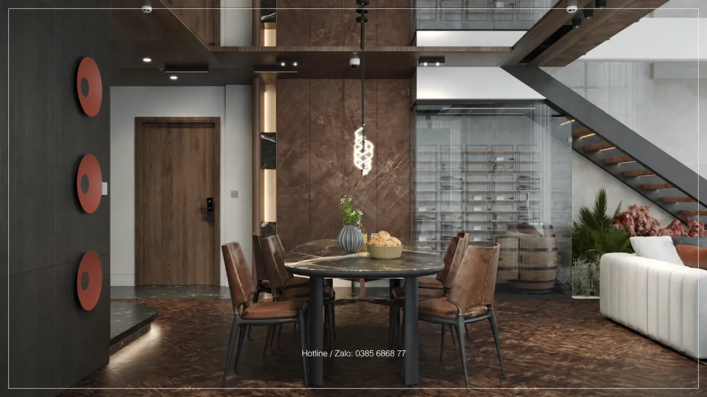 Bàn ăn cạnh vách kính trưng bày dưới cầu thang Penthouse Sky Oasis
