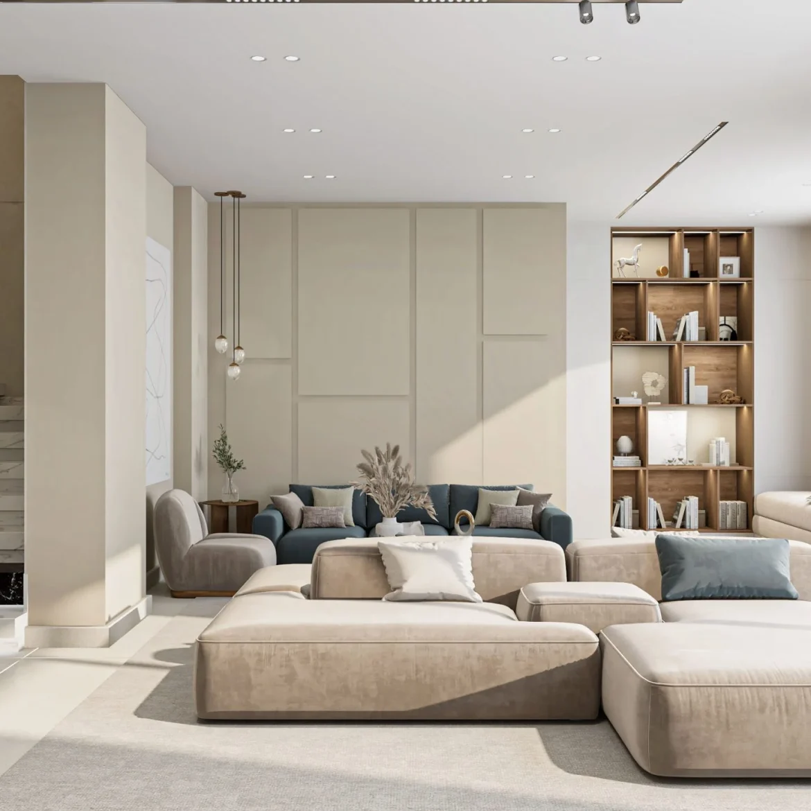 Phòng khách có sofa chữ L sáng màu, gối xanh và kệ gỗ