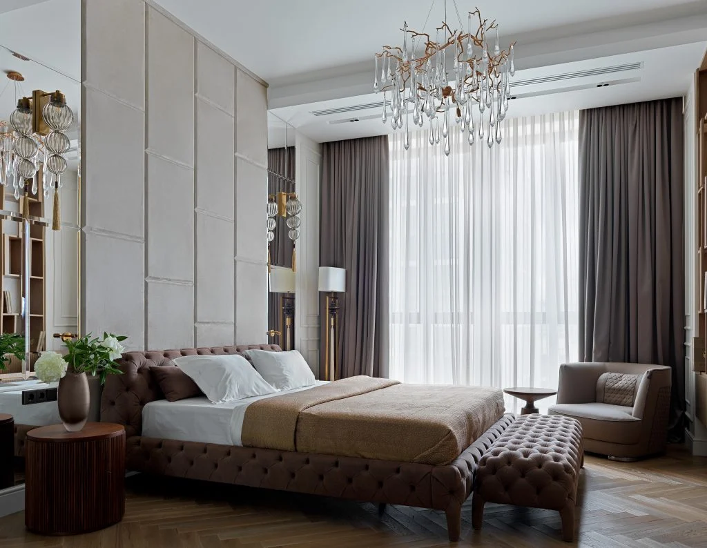 Phòng ngủ Penthouse Gia Lâm với giường bọc, đèn chùm và rèm cửa cao